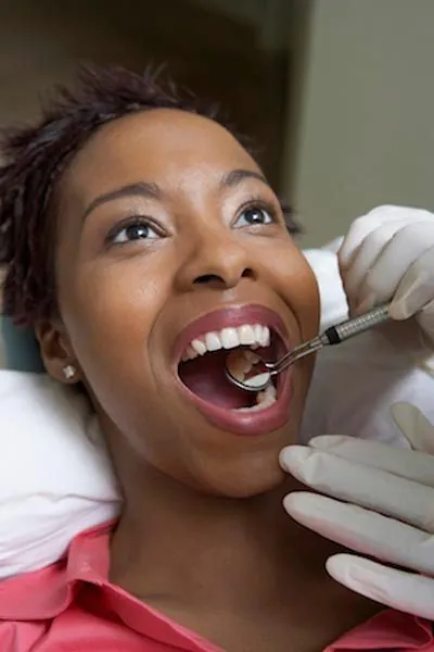 woman getting dental care at CareSmiles Dental