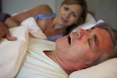 woman awake at night due to husband's sleep apnea